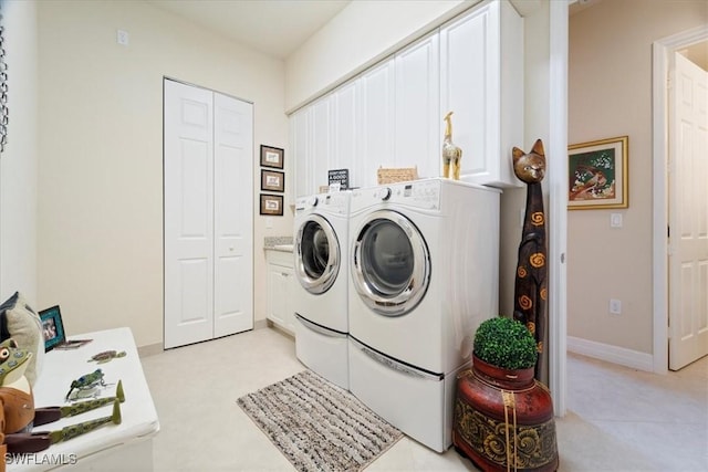 3051 Hudson Ter, Naples, FL 34119 - laundry room with cabinet space and independent washer and dryer
