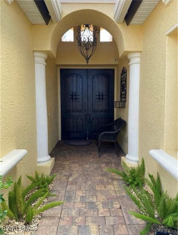 11491 Axis Deer Ln, Fort Myers, FL 33966 - doorway to property with stucco siding