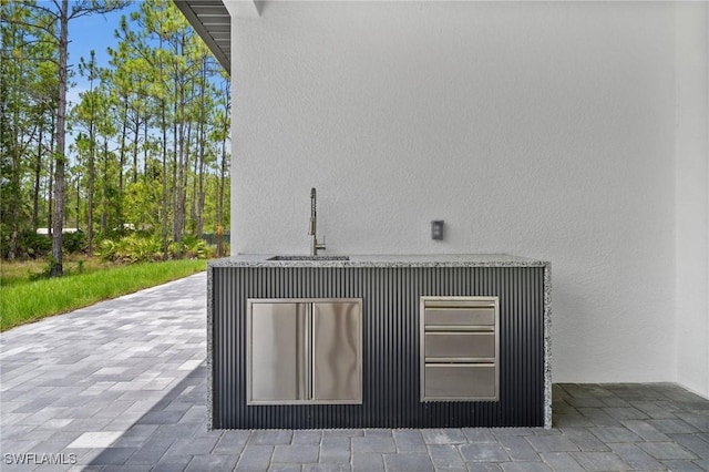 4234 27th Ave NE, Naples, FL 34120 - exterior view of a sink and stucco siding