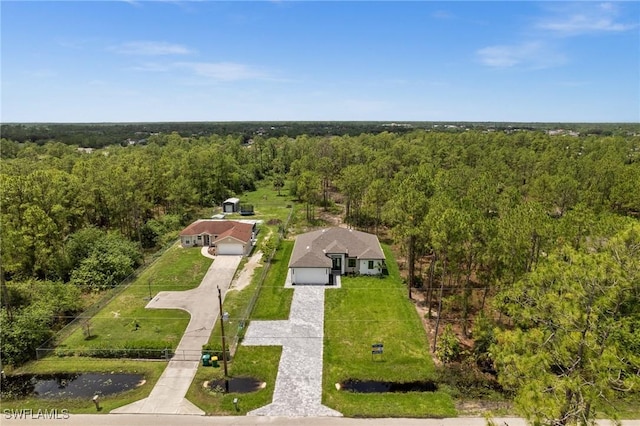 4234 27th Ave NE, Naples, FL 34120 - aerial view of property and surrounding area featuring a heavily wooded area