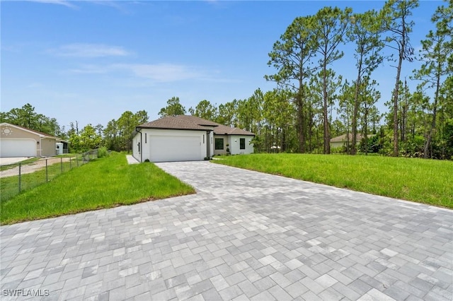 4234 27th Ave NE, Naples, FL 34120 - view of front of house with decorative driveway and a garage