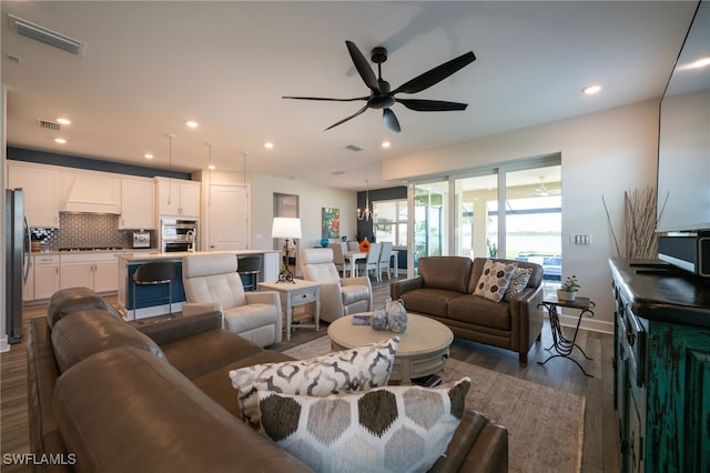 42243 Edgewater Dr, Punta Gorda, FL 33982 - living room with ceiling fan, wood finished floors, and recessed lighting