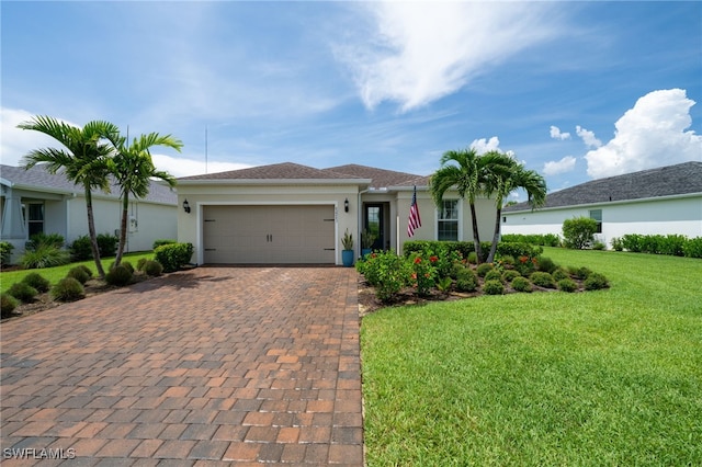 42243 Edgewater Dr, Punta Gorda, FL 33982 - ranch-style house with decorative driveway, a garage, stucco siding, and a front lawn