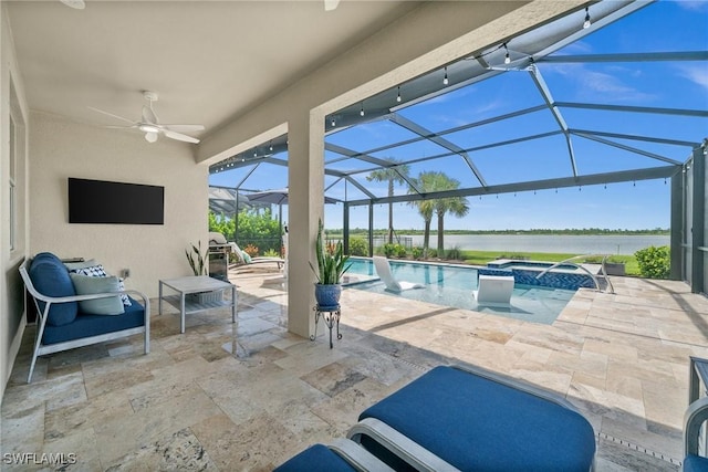 42243 Edgewater Dr, Punta Gorda, FL 33982 - view of patio featuring a water view, a ceiling fan, a pool with connected hot tub, and glass enclosure