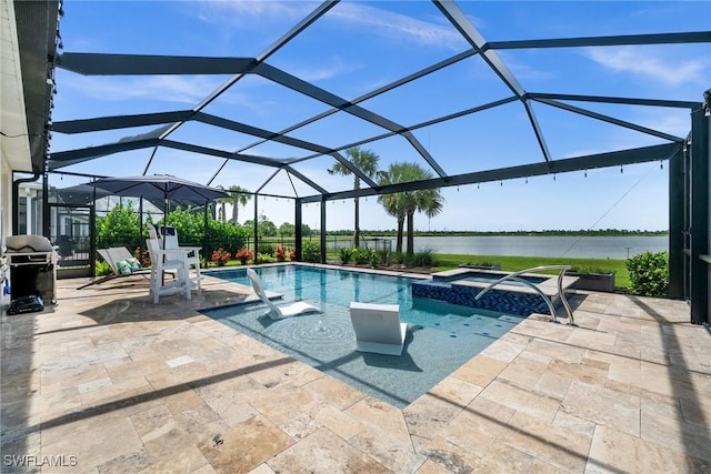 42243 Edgewater Dr, Punta Gorda, FL 33982 - view of pool with a water view, a patio, area for grilling, and a pool with connected hot tub