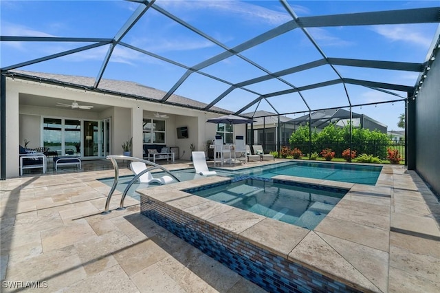 42243 Edgewater Dr, Punta Gorda, FL 33982 - view of pool featuring a ceiling fan, a patio area, a pool with connected hot tub, and glass enclosure