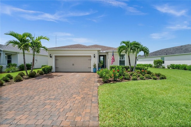 42243 Edgewater Dr, Punta Gorda, FL 33982 - single story home with decorative driveway, a front lawn, an attached garage, and stucco siding