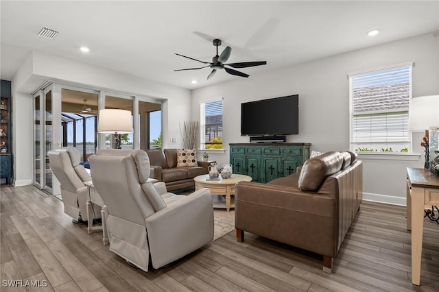 42243 Edgewater Dr, Punta Gorda, FL 33982 - living room with a ceiling fan, wood finished floors, plenty of natural light, and recessed lighting