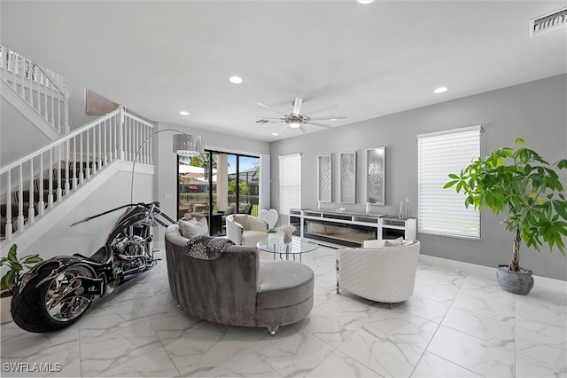 4692 Kensington Cir, Naples, FL 34119 - living area with stairs, marble finish floors, recessed lighting, and a ceiling fan