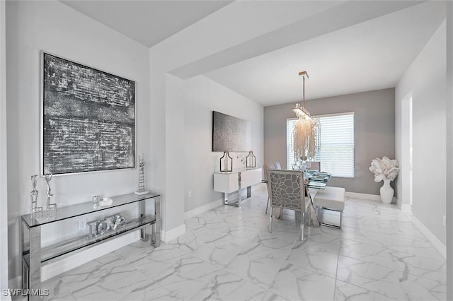 4692 Kensington Cir, Naples, FL 34119 - dining area featuring marble look tiles and a chandelier