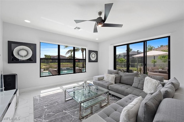 4692 Kensington Cir, Naples, FL 34119 - living room featuring marble finish flooring, a ceiling fan, and recessed lighting