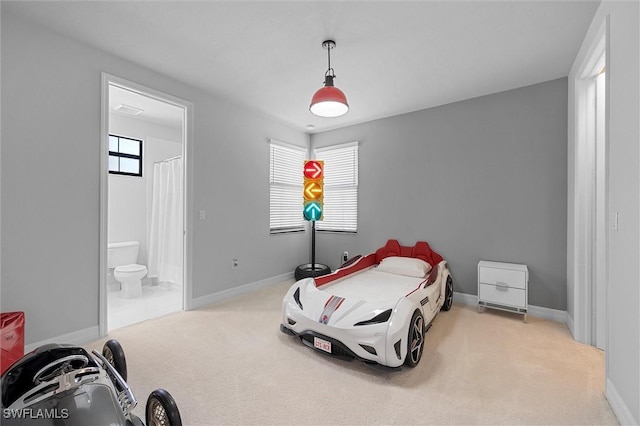 4692 Kensington Cir, Naples, FL 34119 - bedroom featuring carpet, multiple windows, and ensuite bathroom