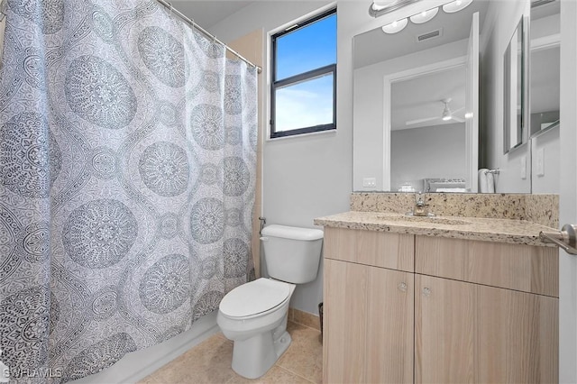 4692 Kensington Cir, Naples, FL 34119 - bathroom with tile patterned floors, vanity, and a ceiling fan