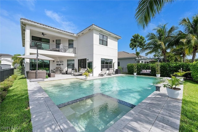 4692 Kensington Cir, Naples, FL 34119 - back of property with an outdoor living space, a balcony, a tile roof, and stucco siding