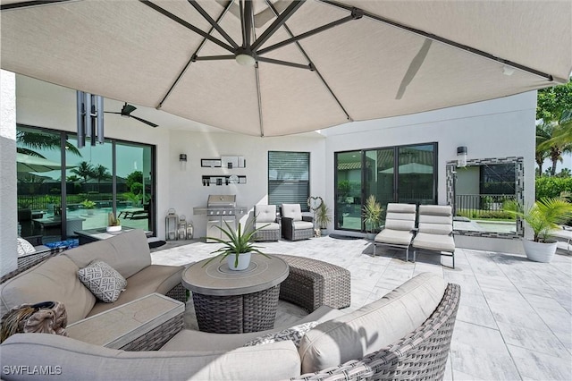 4692 Kensington Cir, Naples, FL 34119 - view of patio featuring outdoor lounge area and grilling area