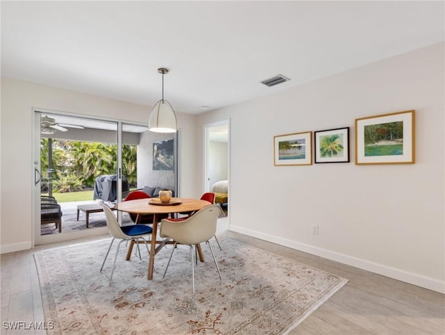 3704 Blue Heron Dr, Fort Myers, FL 33908 - dining area featuring baseboards and wood finished floors