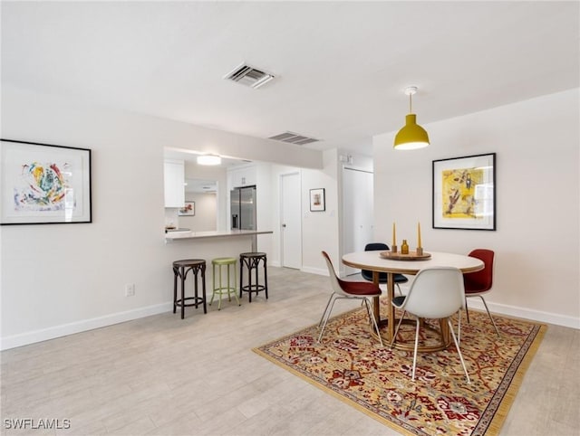 3704 Blue Heron Dr, Fort Myers, FL 33908 - dining space featuring baseboards and light wood-type flooring