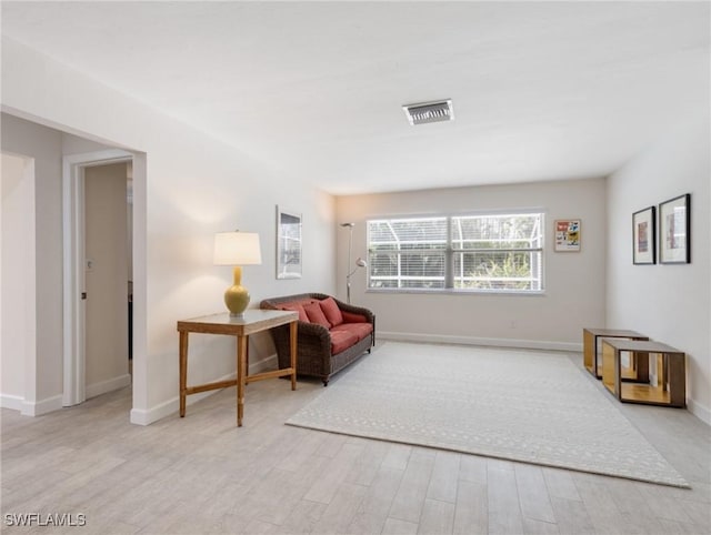 3704 Blue Heron Dr, Fort Myers, FL 33908 - living area featuring light wood-type flooring and baseboards