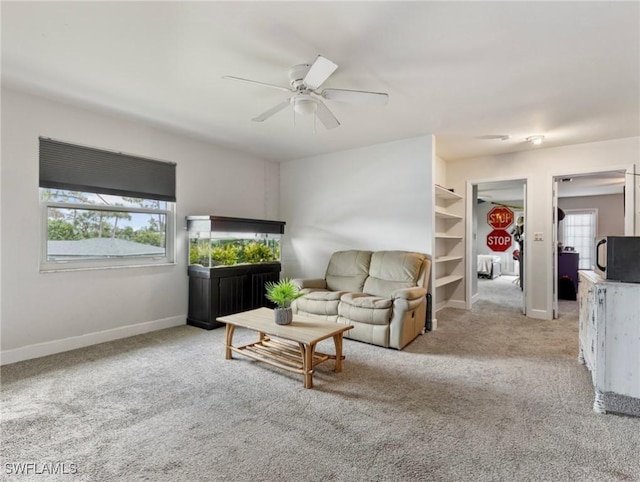 3704 Blue Heron Dr, Fort Myers, FL 33908 - living area with carpet and ceiling fan
