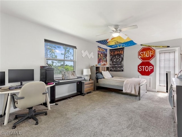 3704 Blue Heron Dr, Fort Myers, FL 33908 - bedroom with a desk, light colored carpet, and a ceiling fan