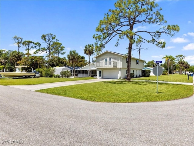 3704 Blue Heron Dr, Fort Myers, FL 33908 - view of front of home with concrete driveway, a front yard, and an attached garage