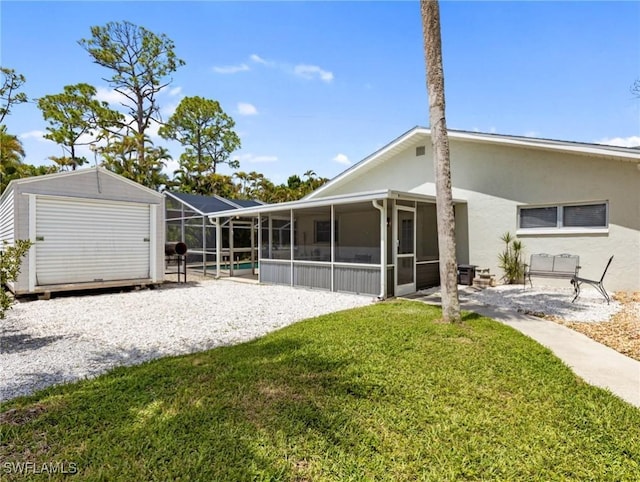 3704 Blue Heron Dr, Fort Myers, FL 33908 - back of house featuring a storage shed, a yard, stucco siding, a sunroom, and a pool