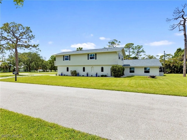 3704 Blue Heron Dr, Fort Myers, FL 33908 - view of side of home featuring a yard