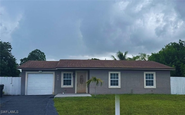 405 SW 79th Ter, North Lauderdale, FL 33068 - ranch-style home featuring an attached garage, asphalt driveway, and stucco siding