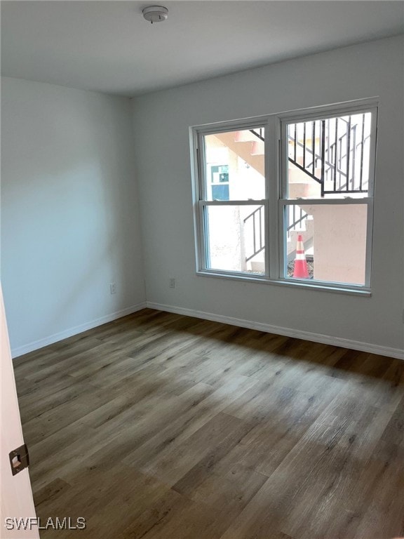 16881 Davis Rd Unit 713, Fort Myers, FL 33908 - unfurnished room with wood finished floors and a smoke detector