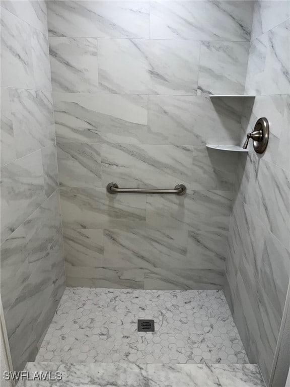 16881 Davis Rd Unit 713, Fort Myers, FL 33908 - bathroom featuring tiled shower