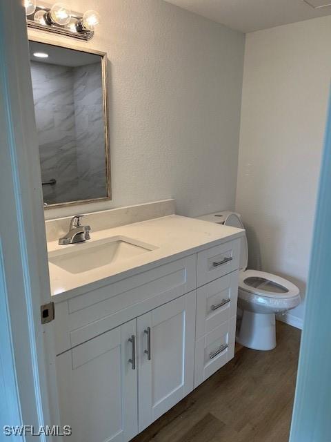 16881 Davis Rd Unit 713, Fort Myers, FL 33908 - bathroom with vanity and wood finished floors