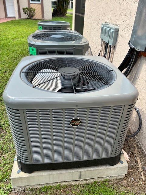 16881 Davis Rd Unit 713, Fort Myers, FL 33908 - exterior view of a central air condition unit and stucco siding