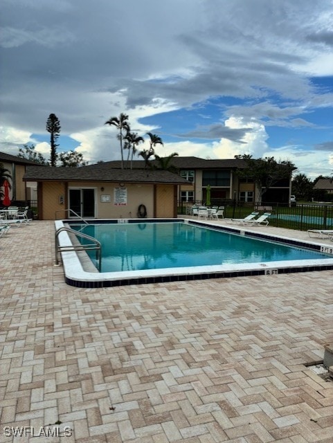 16881 Davis Rd Unit 713, Fort Myers, FL 33908 - community pool featuring a patio