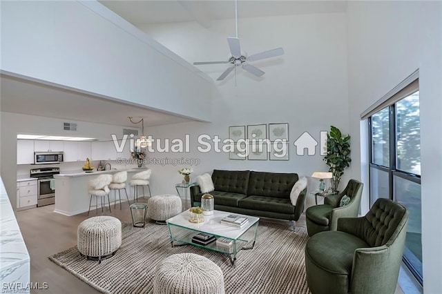 8441 N Haven Ln Unit B, Fort Myers, FL 33919 - living area with high vaulted ceiling, a chandelier, and a ceiling fan