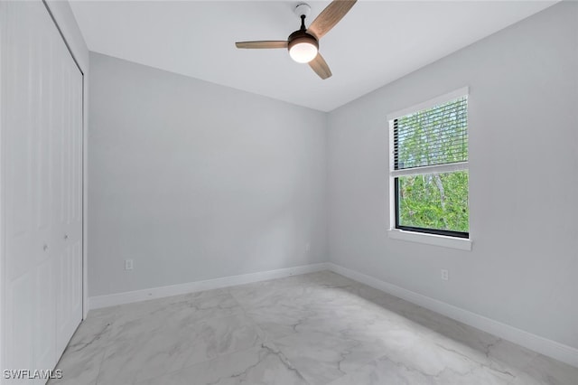 4447 26th Ave SE, Naples, FL 34117 - spare room featuring marble finish flooring and ceiling fan