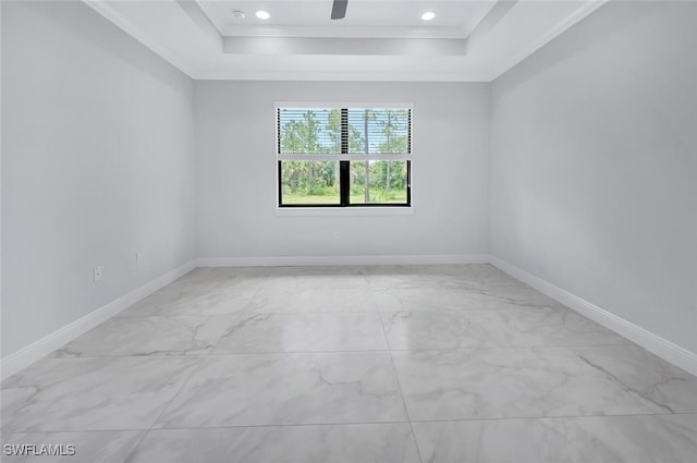 4447 26th Ave SE, Naples, FL 34117 - unfurnished room featuring a tray ceiling, ornamental molding, and light marble finish floors