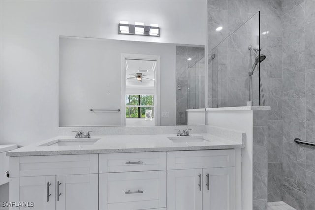 4447 26th Ave SE, Naples, FL 34117 - bathroom featuring a walk in shower, double vanity, and ceiling fan
