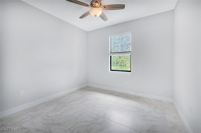 4447 26th Ave SE, Naples, FL 34117 - unfurnished room with marble look tile flooring and ceiling fan