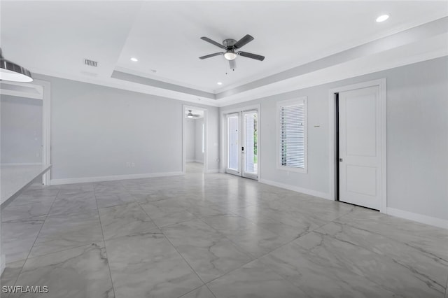 4447 26th Ave SE, Naples, FL 34117 - spare room featuring a ceiling fan, marble look tile flooring, a raised ceiling, and recessed lighting