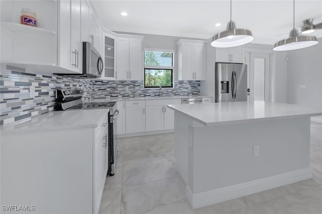 4447 26th Ave SE, Naples, FL 34117 - kitchen with appliances with stainless steel finishes, decorative backsplash, white cabinetry, recessed lighting, and ornamental molding