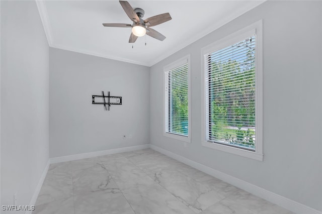 4447 26th Ave SE, Naples, FL 34117 - unfurnished room featuring crown molding, marble finish floors, and ceiling fan