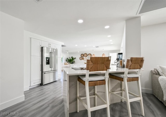 646 Park Shore Dr, Naples, FL 34103 - kitchen featuring high end fridge, light wood-style floors, white cabinetry, light countertops, and recessed lighting