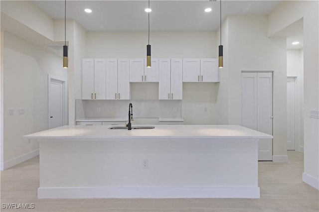 3801 14th St W, Lehigh Acres, FL 33971 - kitchen featuring a center island with sink, white cabinets, light countertops, and recessed lighting