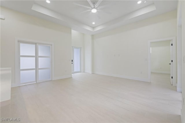 3801 14th St W, Lehigh Acres, FL 33971 - spare room featuring a raised ceiling, light wood finished floors, recessed lighting, and ceiling fan