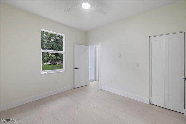 3801 14th St W, Lehigh Acres, FL 33971 - unfurnished bedroom with ceiling fan and a closet