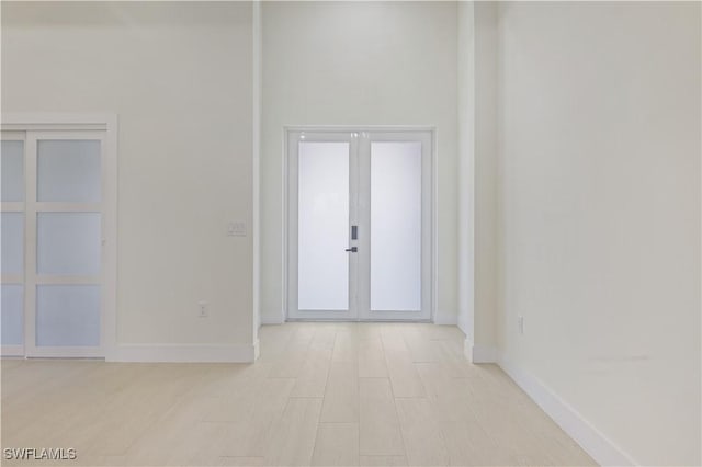 3801 14th St W, Lehigh Acres, FL 33971 - entryway featuring baseboards and french doors