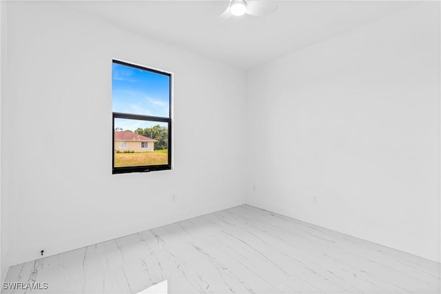 7071 Tide Cir, Labelle, FL 33935 - unfurnished room with marble finish floors and ceiling fan