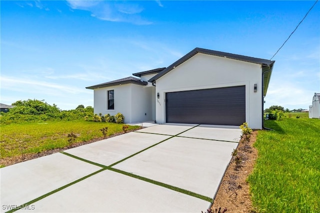 7071 Tide Cir, Labelle, FL 33935 - view of front of house featuring stucco siding, a garage, driveway, and a front yard