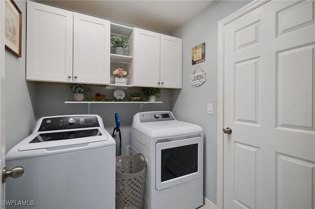 2804 NW 6th St, Cape Coral, FL 33993 - washroom featuring washer and clothes dryer and cabinet space