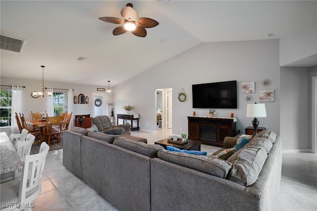 2804 NW 6th St, Cape Coral, FL 33993 - living area featuring ceiling fan, a chandelier, a fireplace, and high vaulted ceiling